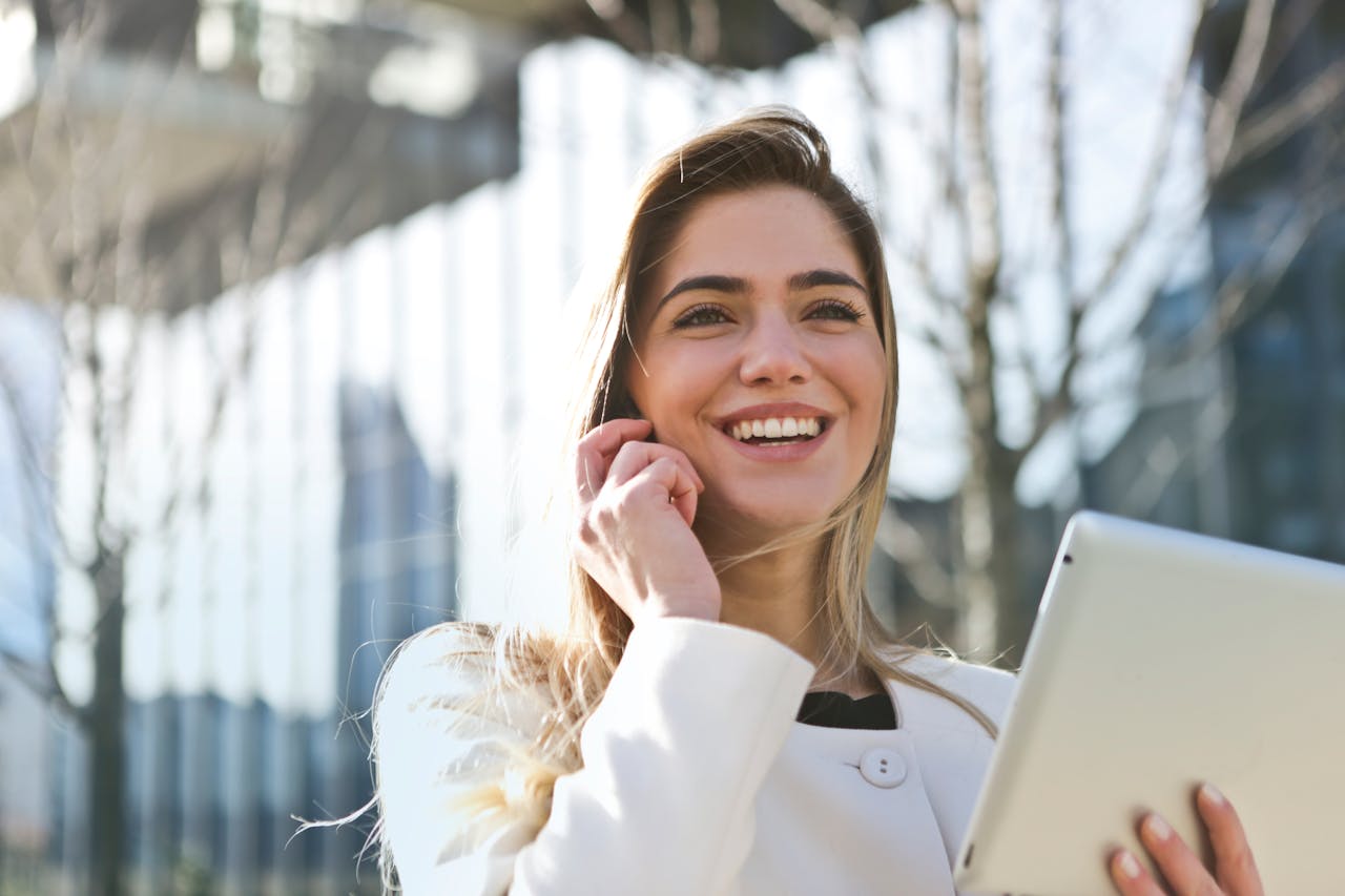 Woman In White Blazer Holding Tablet Computer 789822 1